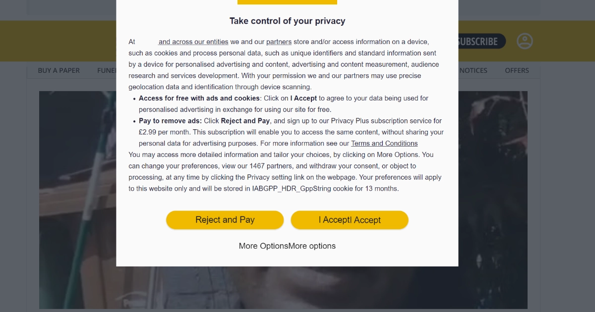 A cookie banner covering a news website, offering accept all, reject and pay, or more options